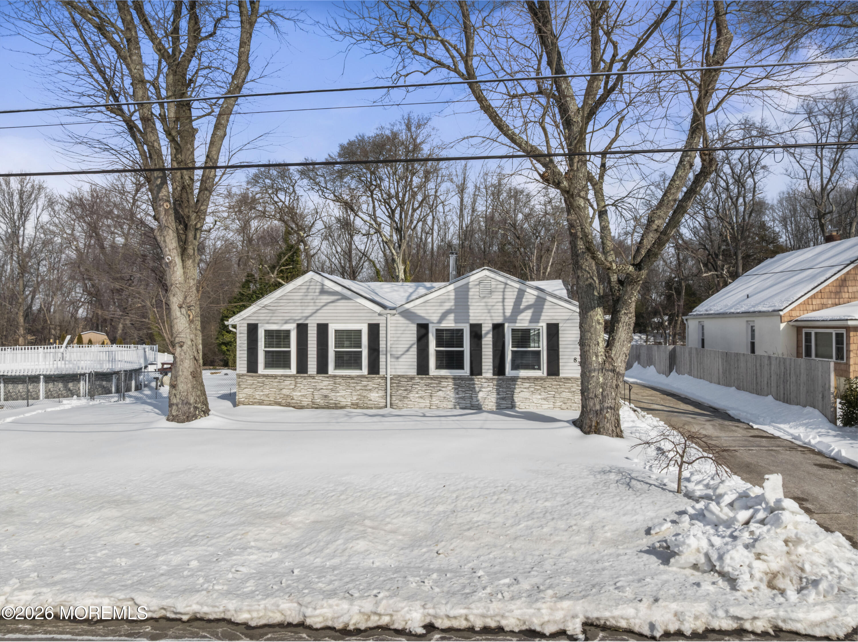 83 Chesterfield Jacobstown Road Wrightstown, NJ 08562 - Photo 5 of 52 a front view of a house with a yard covered in snow
