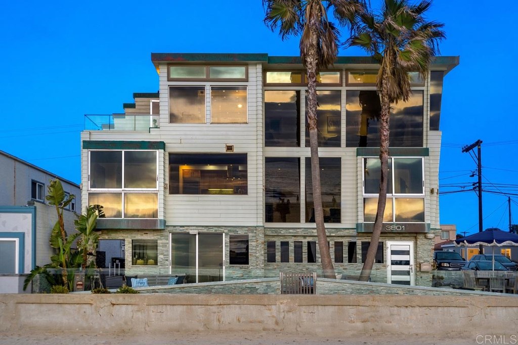 A prominent local architect designed a modern contemporary with windows to enhance ocean views!