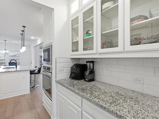 a kitchen with a sink stove and refrigerator