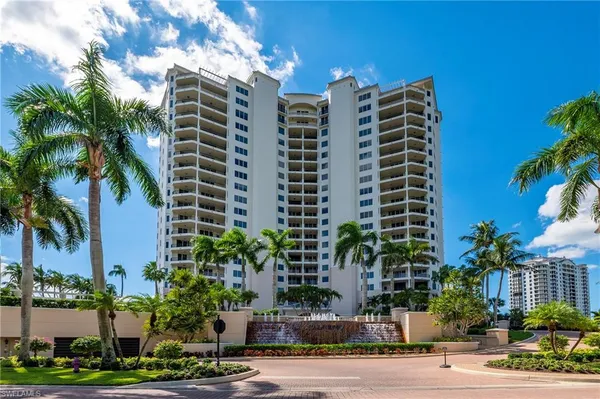a front view of building and trees