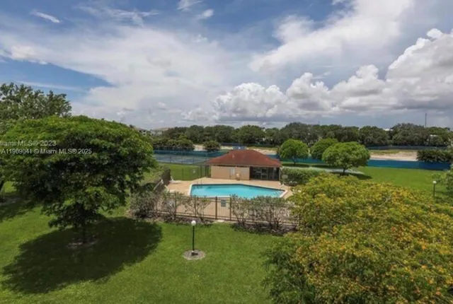 a view of a lake with a house in the background
