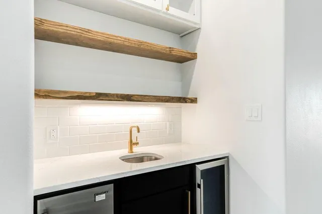 a kitchen with a sink and cabinets