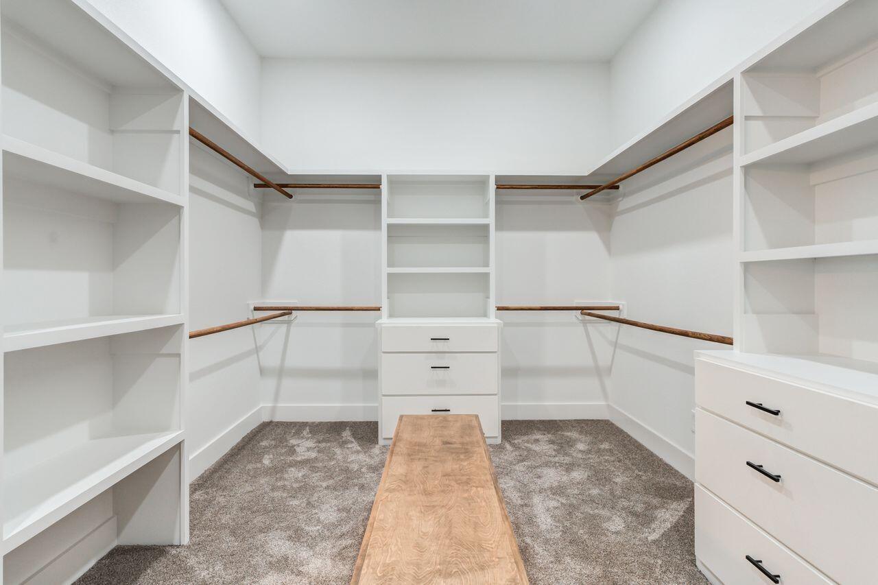 6601 North C R 1500 Shallowater, TX 79363 - Photo 20 of 39 a view of walk in closet with empty racks