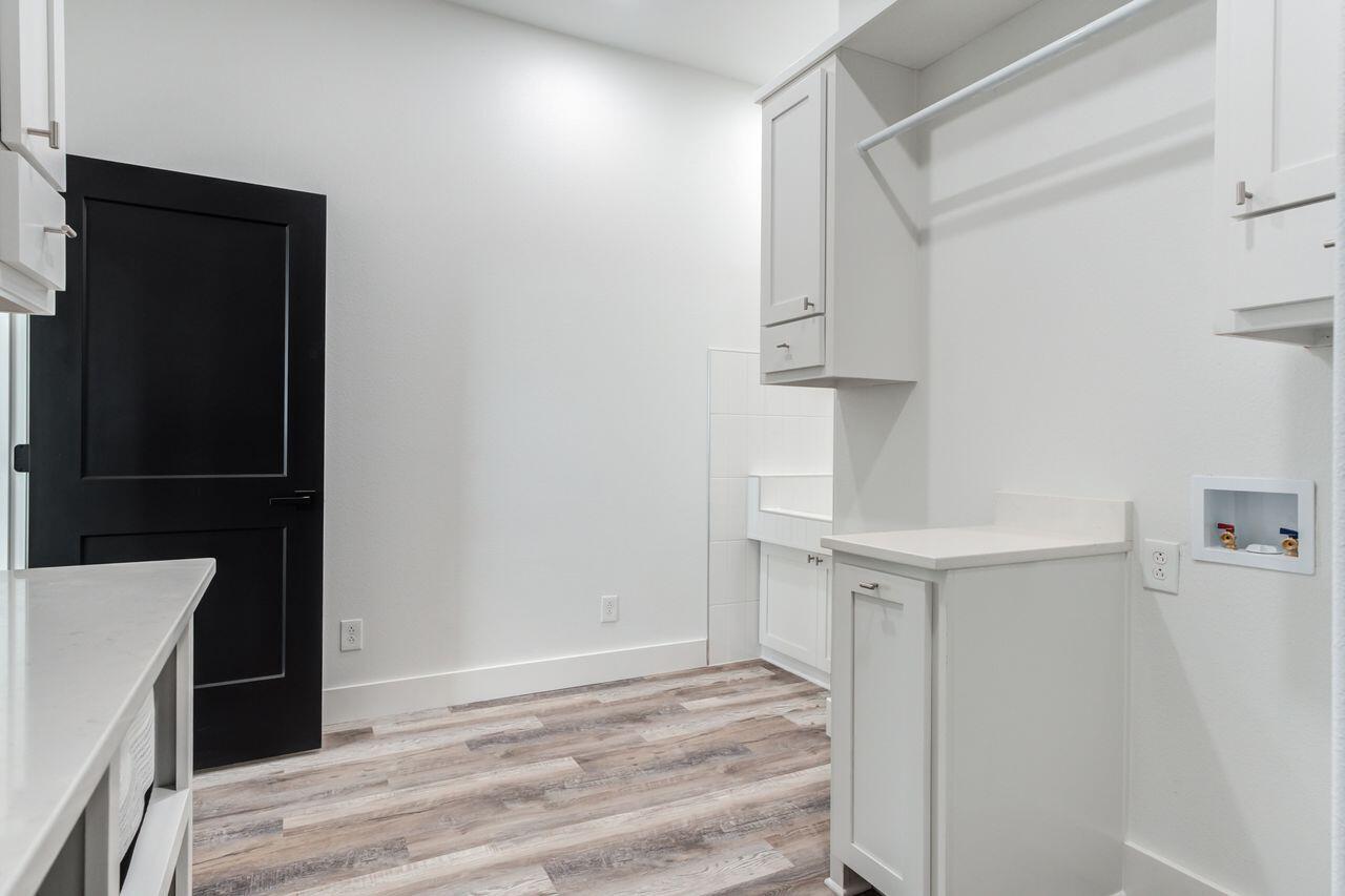 6601 North C R 1500 Shallowater, TX 79363 - Photo 22 of 39 a view of walk in closet with empty racks