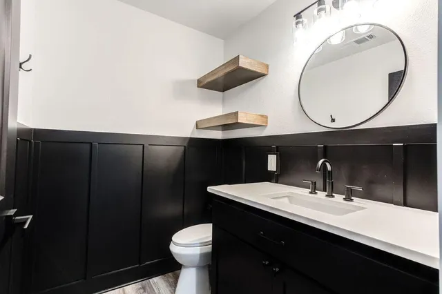 an empty room with windows and closet