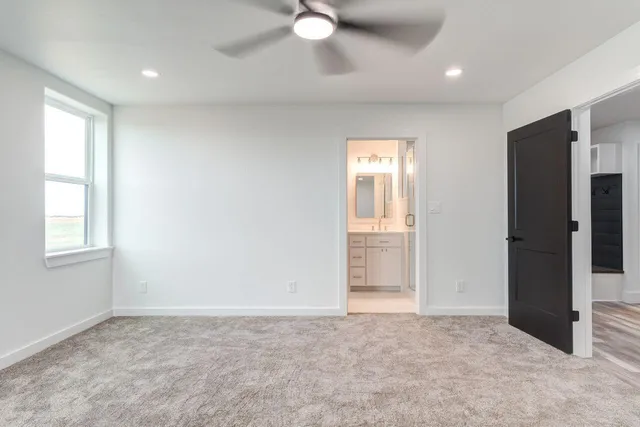 a kitchen with a refrigerator and an oven