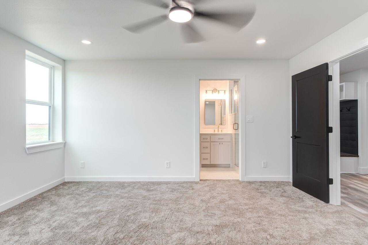 6601 North C R 1500 Shallowater, TX 79363 - Photo 28 of 39 an empty room with windows and closet