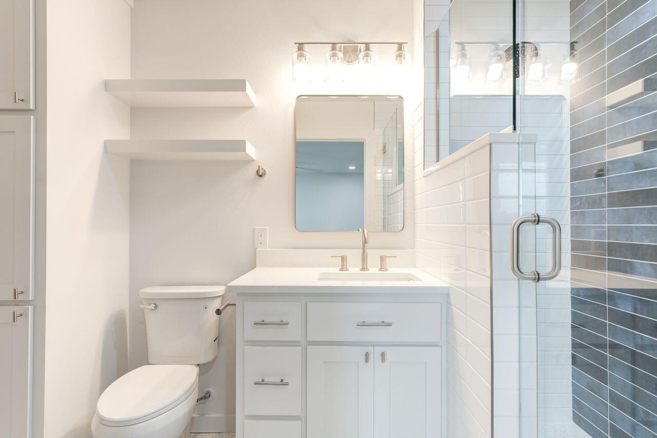 6601 North C R 1500 Shallowater, TX 79363 - Photo 31 of 39 a bathroom with a sink a toilet and shower