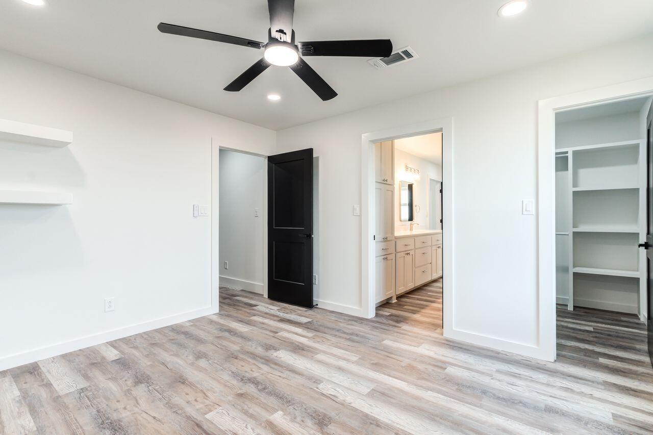 6601 North C R 1500 Shallowater, TX 79363 - Photo 32 of 39 an empty room with closet and windows