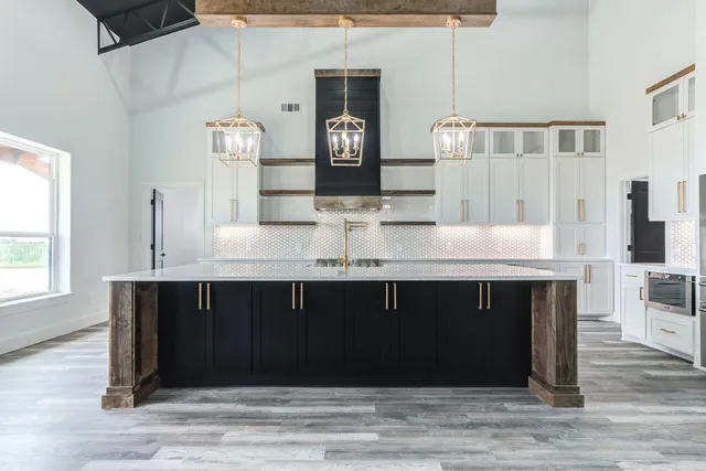 a kitchen with a cabinets and wooden floor