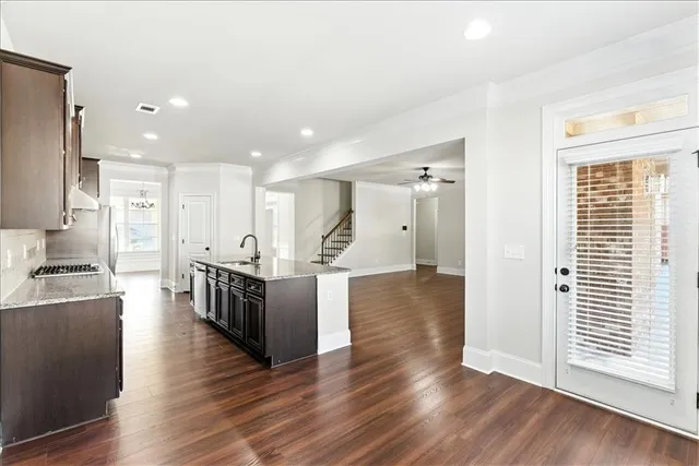 a view of kitchen with cabinets and wooden floor
