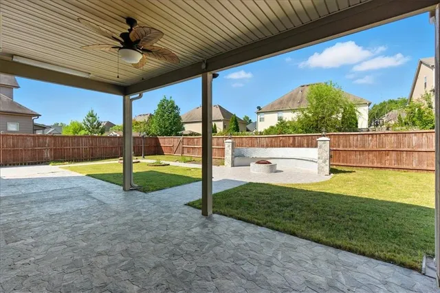 a view of a backyard with grass