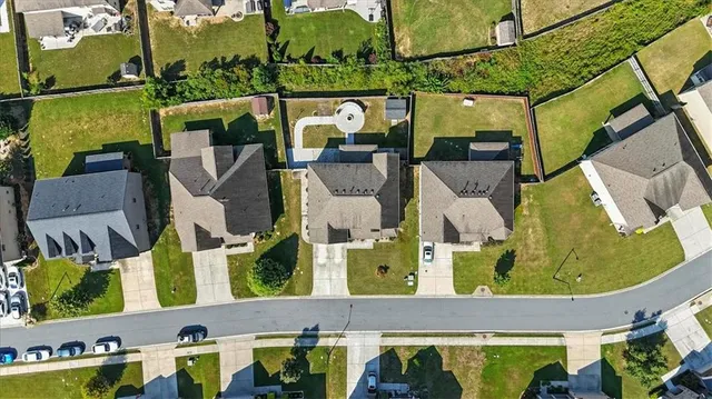 an aerial view of houses with outdoor space