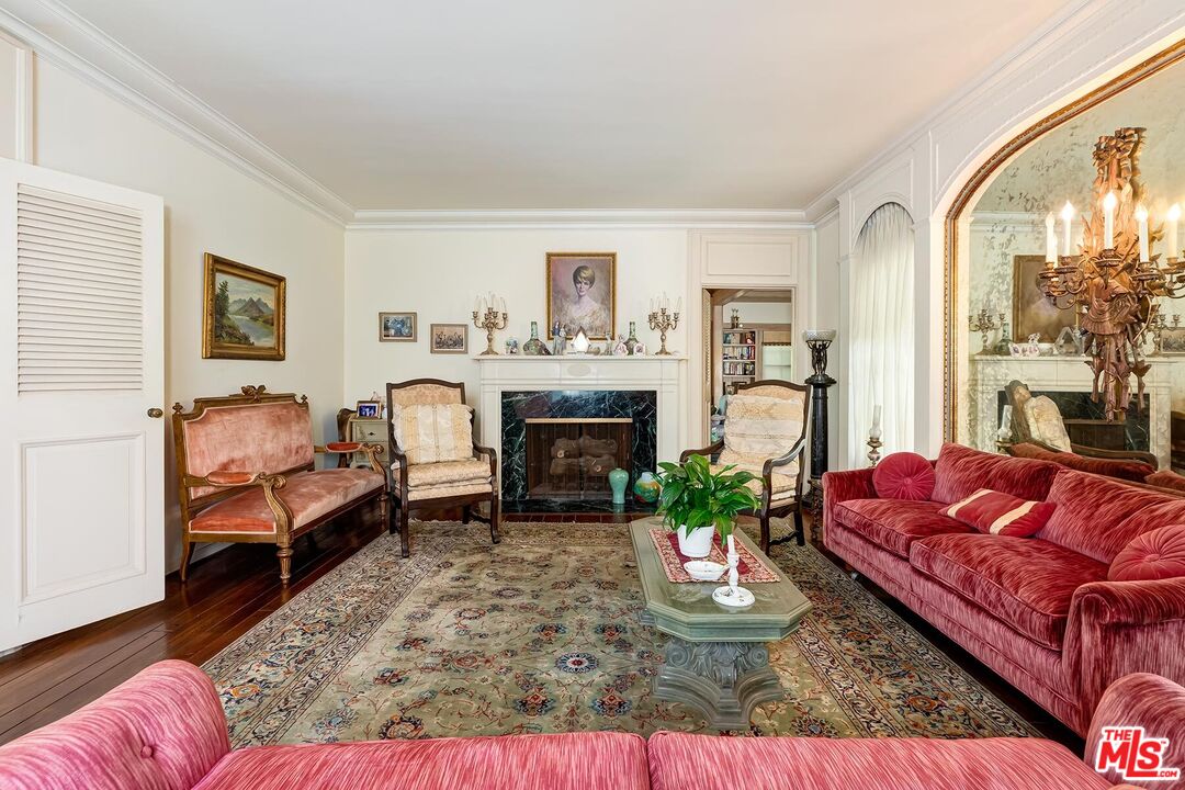 710 North Beverly Drive Beverly Hills, CA 90210 - Photo 11 of 18 a living room with furniture fireplace and a large window