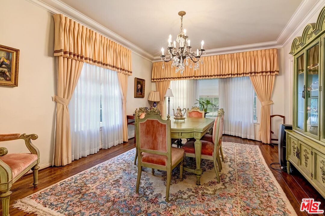710 North Beverly Drive Beverly Hills, CA 90210 - Photo 14 of 18 a view of a dining room with furniture window and wooden floor