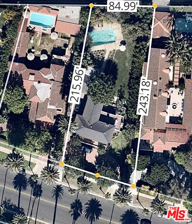 710 North Beverly Drive Beverly Hills, CA 90210 - Photo 16 of 18 an aerial view of multiple houses with yard