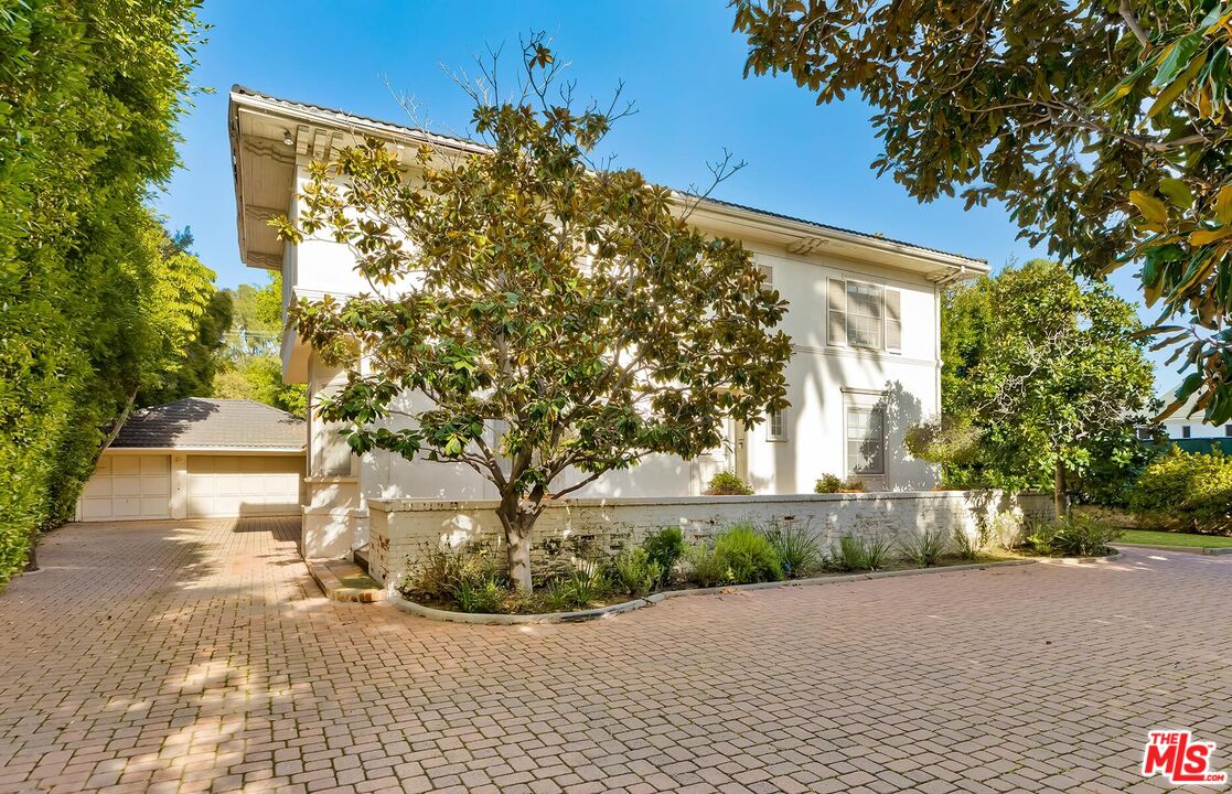 710 North Beverly Drive Beverly Hills, CA 90210 - Photo 5 of 18 a view of a house with a tree