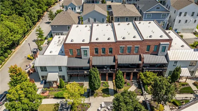 an aerial view of a house with swimming pool