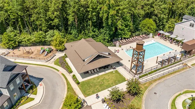 an aerial view of a house with a swimming pool