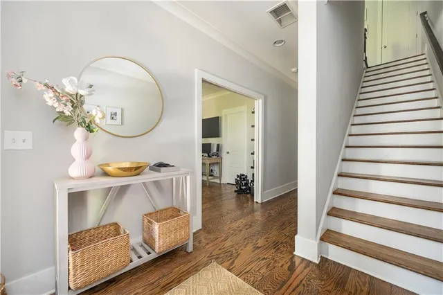 a view of living room with furniture and wooden floor