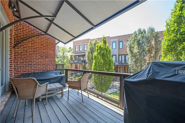 a view of a balcony with furniture