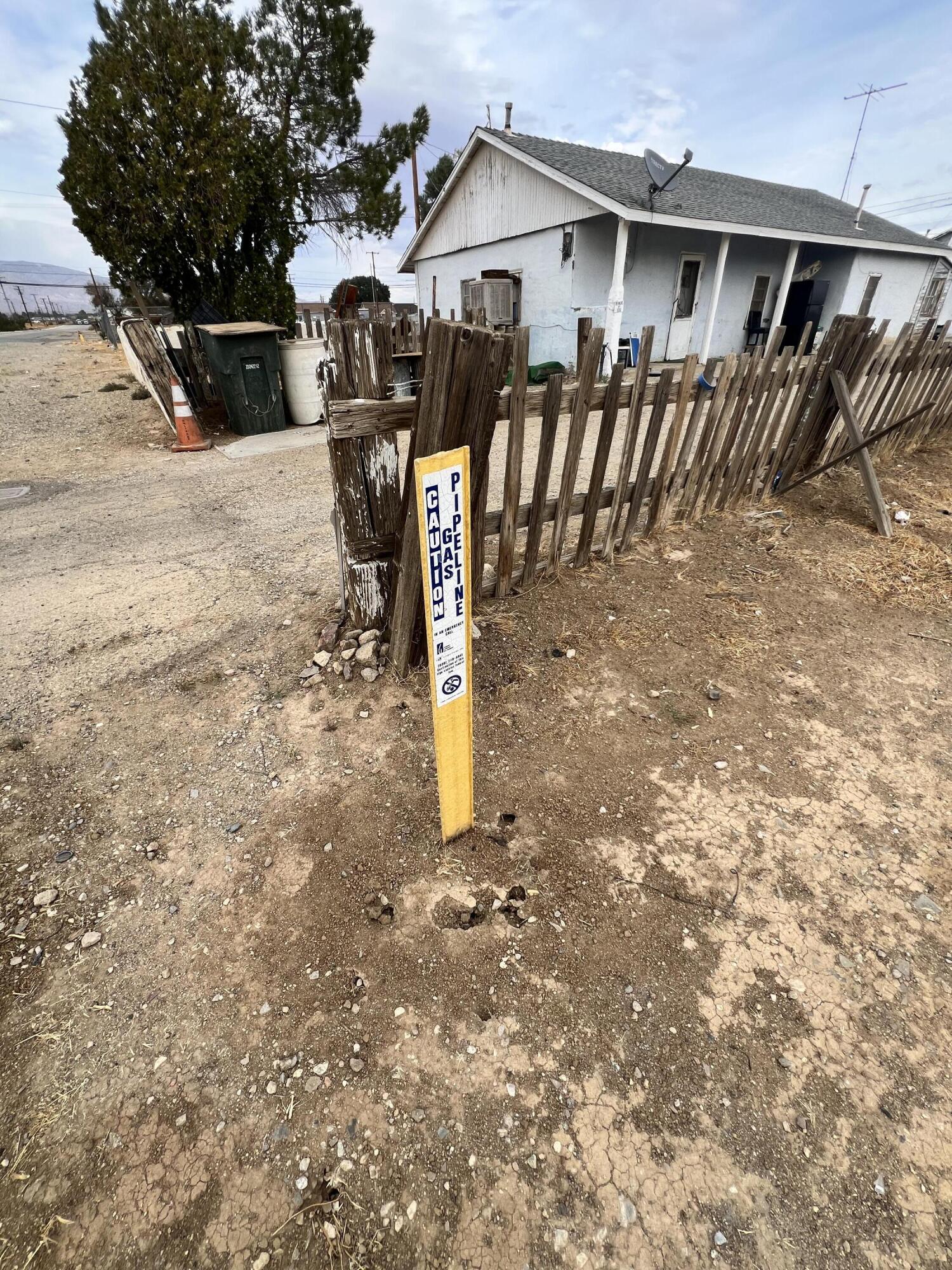 H Street Mojave, CA 93501 - Photo 10 of 11 a view of a house with backyard and a tree