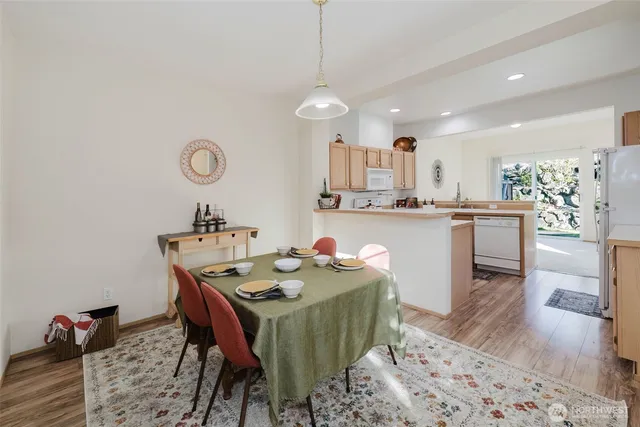 a kitchen with a table and chairs in it