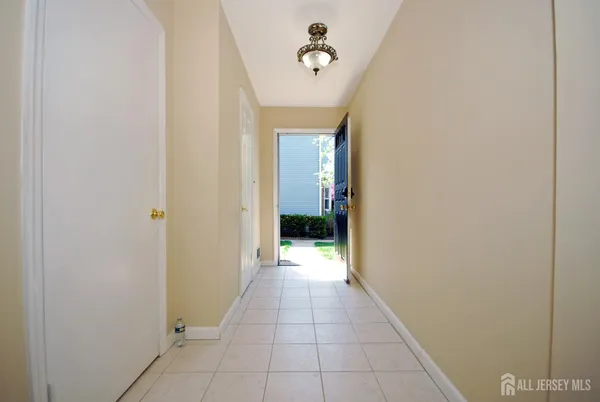 a view of a hallway to a bedroom