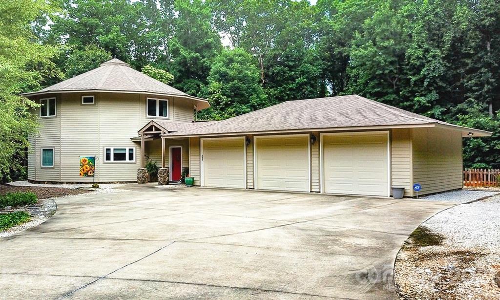 24 Juniper Lane Marion, NC 28752 - Photo 2 of 48 a front view of a house with a garage