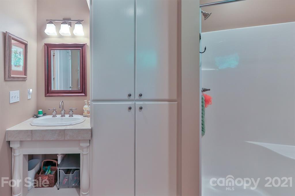 24 Juniper Lane Marion, NC 28752 - Photo 28 of 48 a bathroom with a sink and a mirror