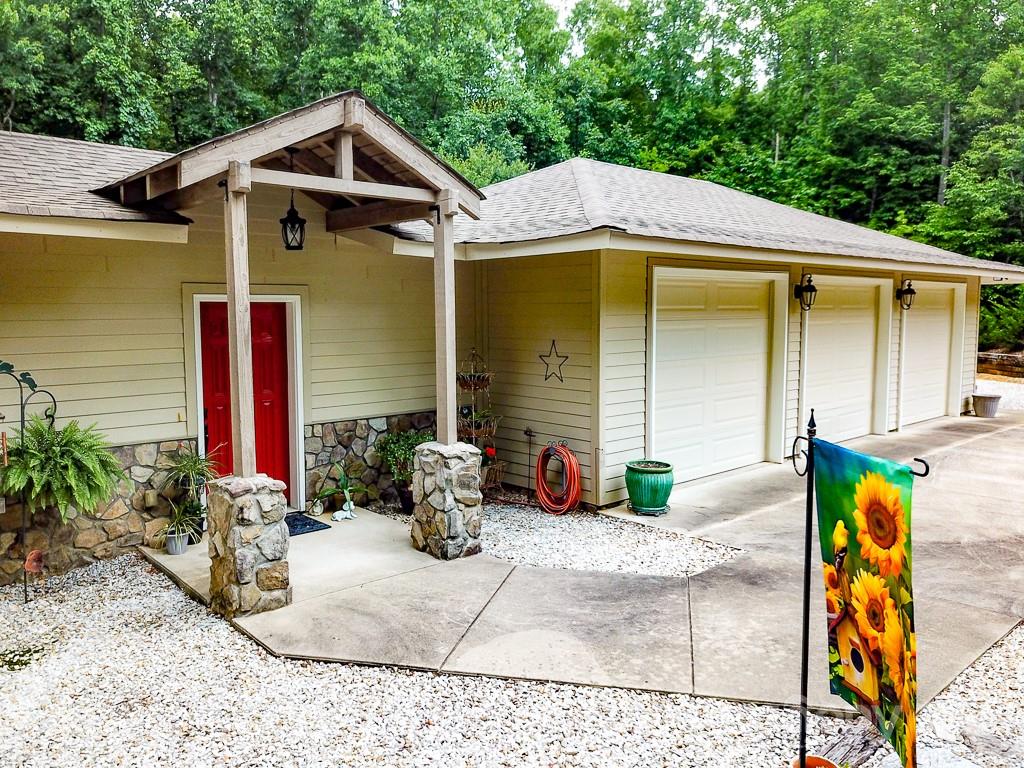 24 Juniper Lane Marion, NC 28752 - Photo 4 of 48 a front view of a house with garden
