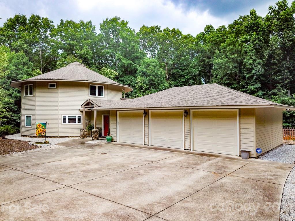 24 Juniper Lane Marion, NC 28752 - Photo 46 of 48 a house with trees in the background
