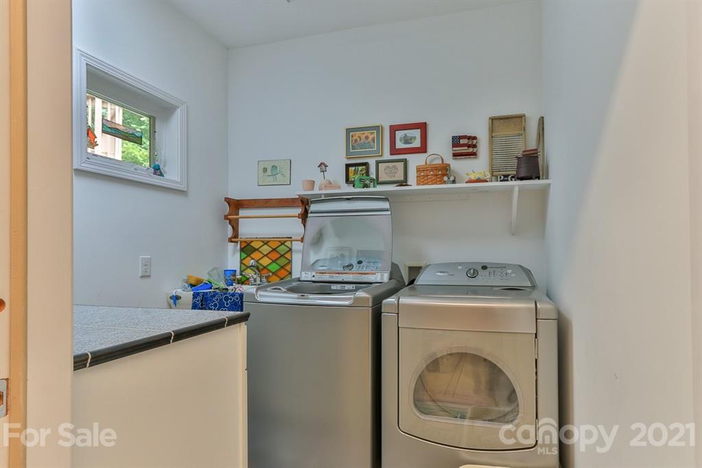 24 Juniper Lane Marion, NC 28752 - Photo 10 of 48 a utility room with sink dryer and washer