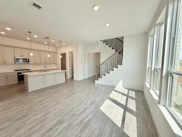 a view of an entryway with wooden floor