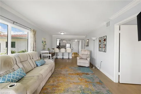 a living room with furniture and view of living room