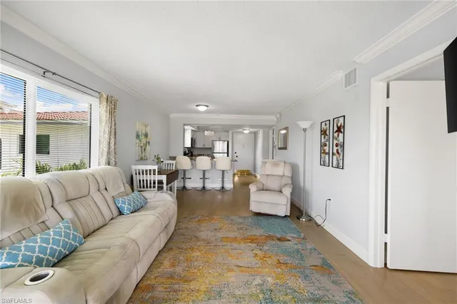 a living room with furniture and view of living room