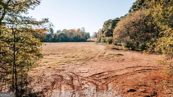 a view of yard covered with snow in front of house