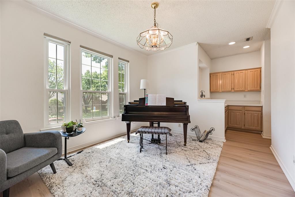 1406 West Peters Colony Road Carrollton, TX 75007 - Photo 24 of 29 a living room with furniture a piano and a window