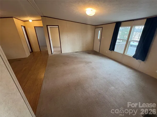 a bathroom with a granite countertop sink a toilet a bathtub and shower