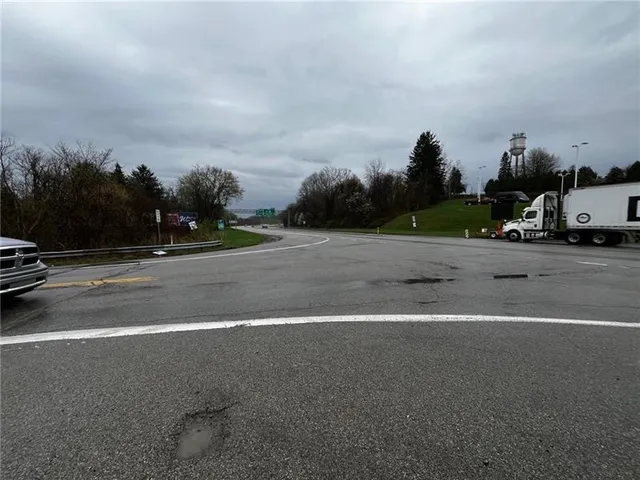 a view of a patio with a yard