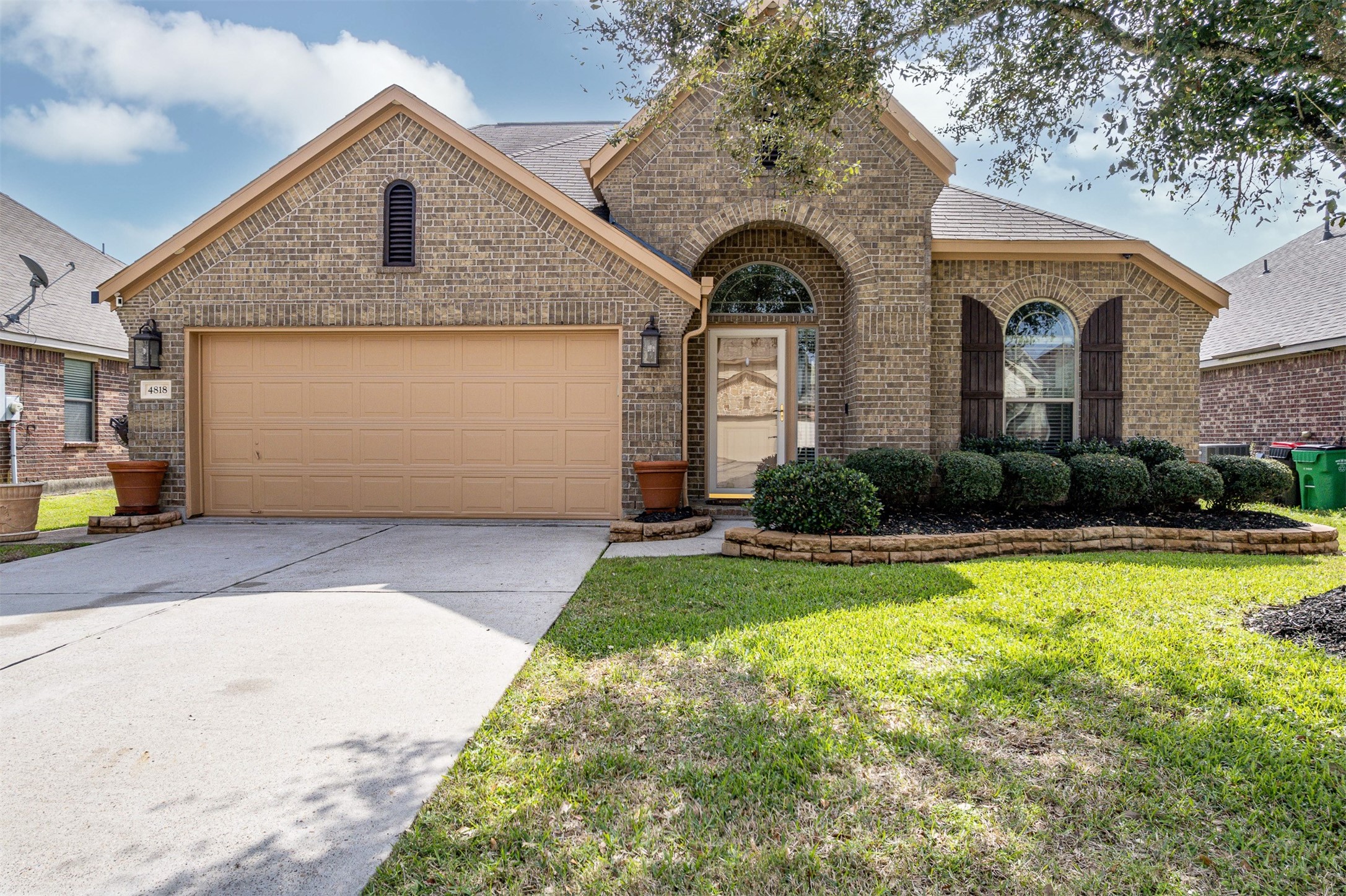 a front view of a house with garage