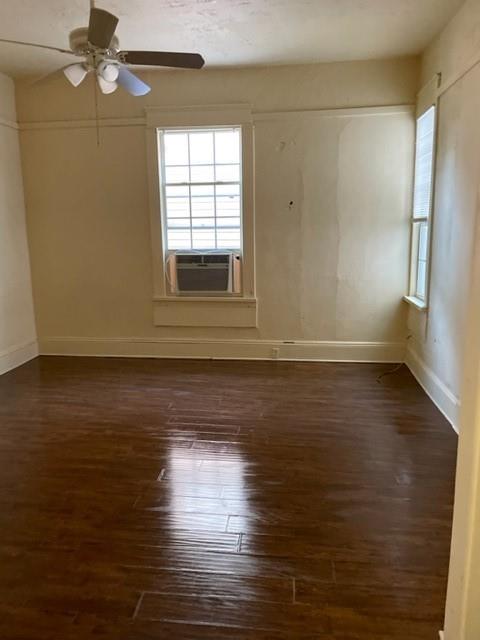 617 West Gandy Street Denison, TX 75020 - Photo 11 of 14 a view of empty room with wooden floor and fan