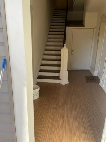 a view of entryway with wooden floor