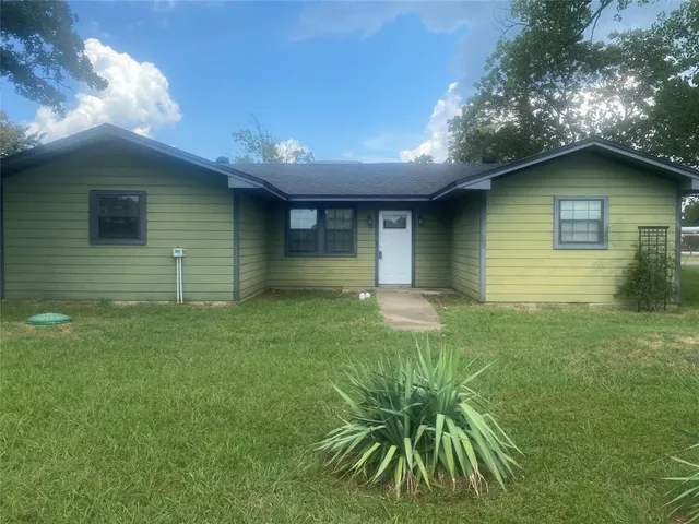 a house view with a backyard space