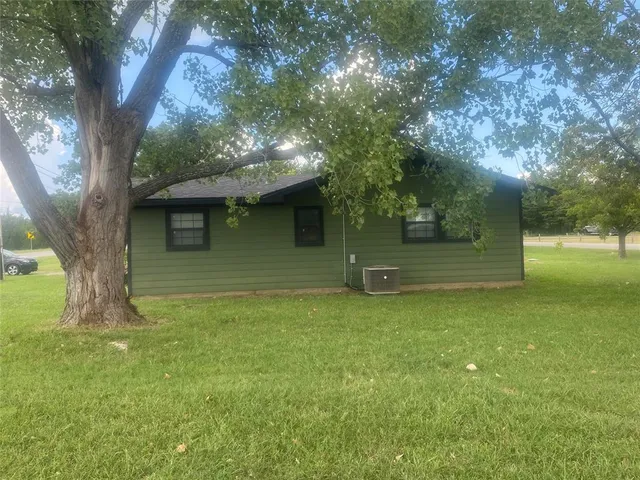 a backyard of a house with lots of green space