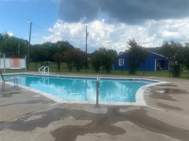 a view of a fountain in front of a house