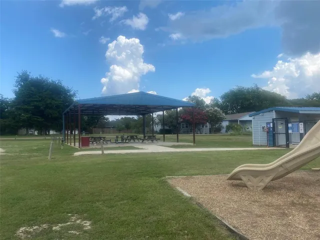 a view of a playground ground and a yard