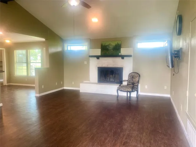 an living room with furniture and a fireplace