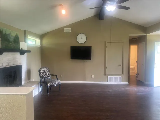 a view of livingroom with furniture wooden floor and fireplace