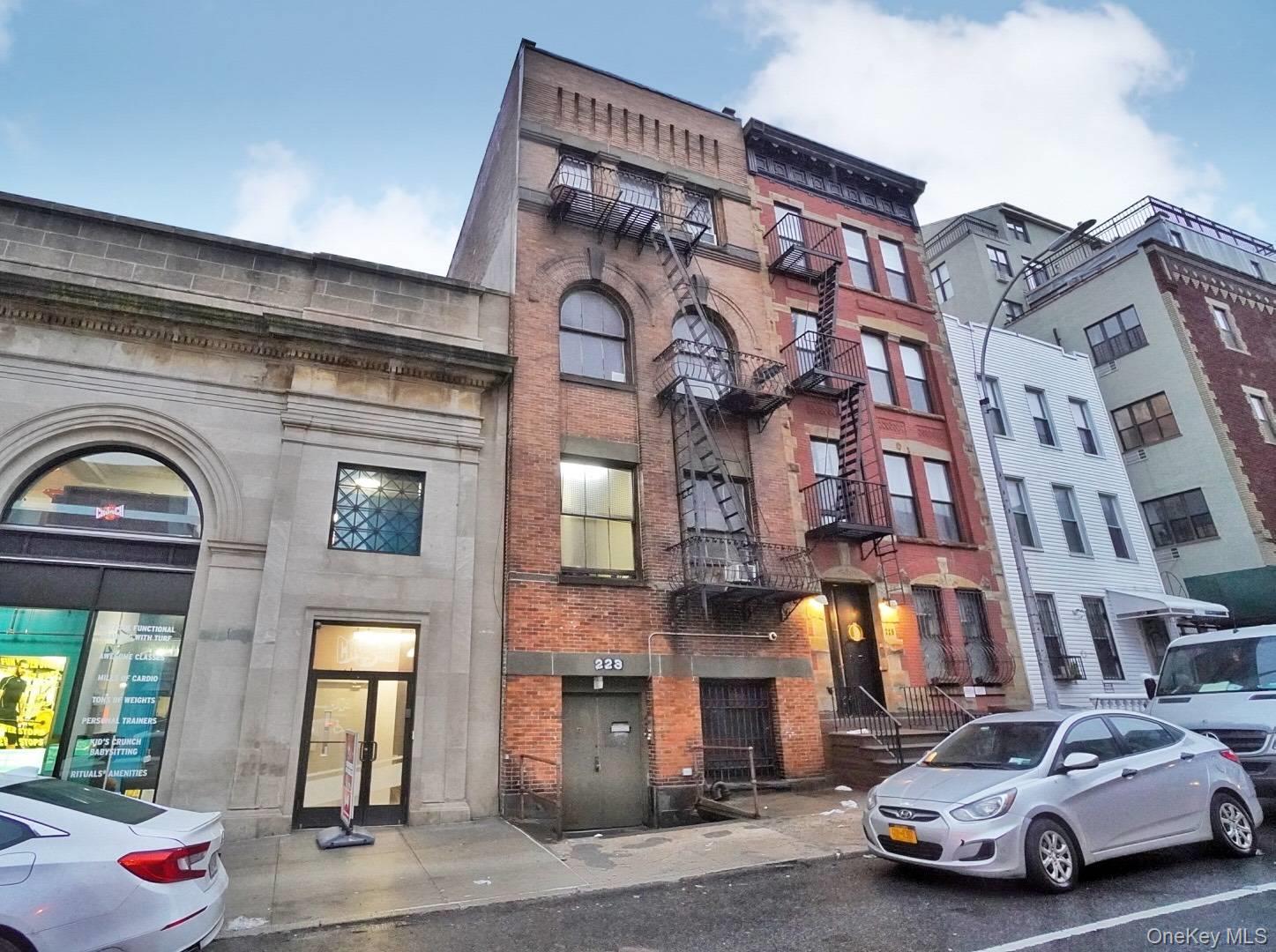 223 15th Street Brooklyn, NY 11215 - Photo 1 of 1 a view of a car park in front of a building